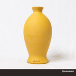 Yellow ceramic greenware vase on a white background, made from Klamath Yellow clay