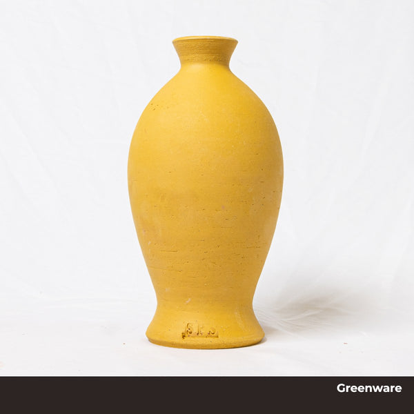 Yellow ceramic greenware vase on a white background, made from Klamath Yellow clay