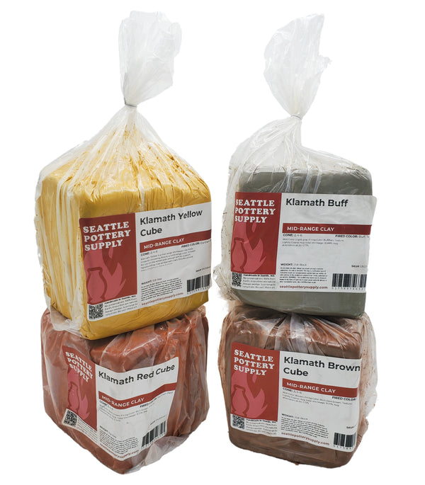 A collection of four marbling clay bodies with varying colors and textures. From left to right, the colors are Klamath Red, Klamath Yellow, Klamath Buff, and Klamath Brown.